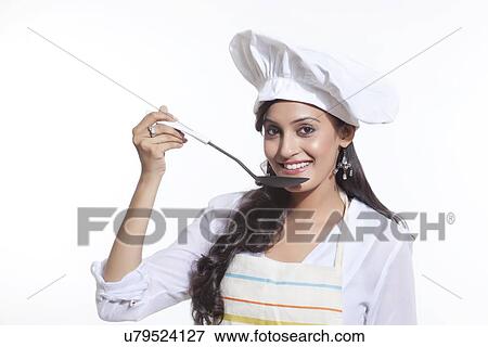 Portrait of a female chef tasting View Large Photo Image Stock Photo - Portrait of a female chef tasting. Fotosearch