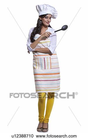 Portrait of a female chef with a utensil View Large Photo Image Stock Image - Portrait of a female chef with a utensil. Fotosearch