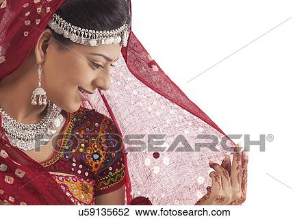 Stock Image - Portrait of a female dandiya dancer . Fotosearch