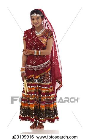 Portrait of a female dandiya dancer with sticks View Large Photo Image Stock Photograph - Portrait of a female dandiya dancer with sticks . Fotosearch