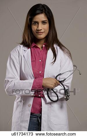 Stock Image - Portrait of a female doctor . Fotosearch