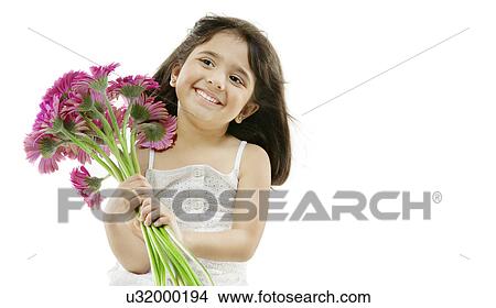 Picture - Portrait of a girl holding flowers . Fotosearch
