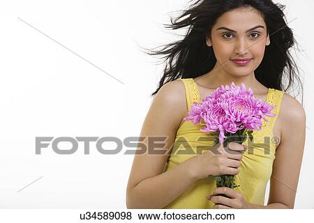 Portrait of a girl with flowers View Large Photo Image Stock Photo - Portrait of a girl with flowers . Fotosearch