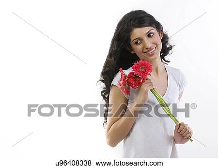 Stock Photo - Portrait of a girl with flowers . Fotosearch