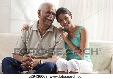 Stock Image - Portrait of a grandfather and granddaughter. Fotosearch