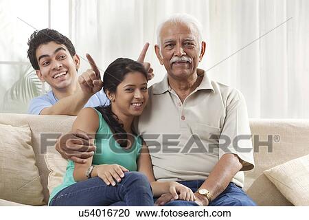 Portrait of a grandfather and grandchildren View Large Photo Image Stock Image - Portrait of a grandfather and grandchildren. Fotosearch