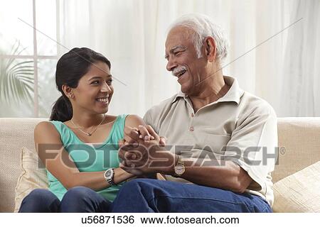 Stock Photograph - Portrait of a grandfather and granddaughter. Fotosearch