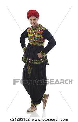 Stock Image - Portrait of a male dandiya dancer . Fotosearch