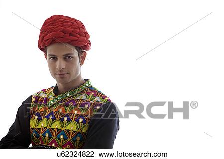 Stock Image - Portrait of a male dandiya dancer . Fotosearch