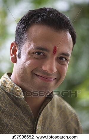 Stock Image - Portrait of a man smiling . Fotosearch