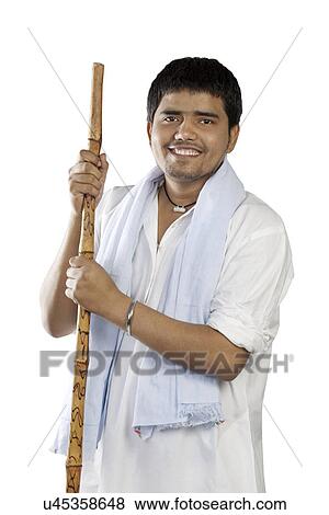 Stock Photo - Portrait of a man with a stick . Fotosearch