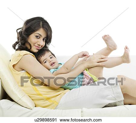Portrait of a mother with her baby View Large Photo Image Stock Image - Portrait of a mother with her baby . Fotosearch