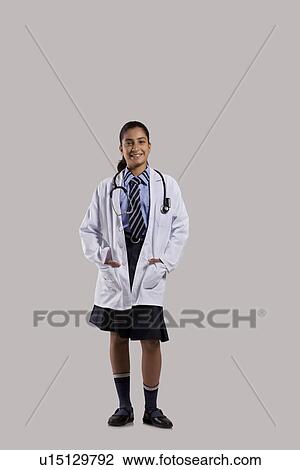 Portrait of a school girl in doctors uniform View Large Photo Image Stock Image - Portrait of a school girl in doctors uniform . Fotosearch