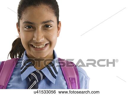 Stock Photograph - Portrait of a school girl smiling . Fotosearch