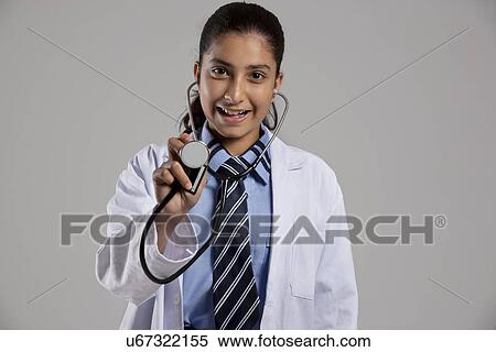 Portrait of a school girl with a stethoscope View Large Photo Image Stock Photography - Portrait of a school girl with a stethoscope . Fotosearch