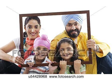Portrait of a Sikh family through a wooden frame View Large Photo Image Stock Photo - Portrait of a Sikh family through a wooden frame . Fotosearch