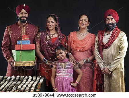 Picture - Portrait of a Sikh family with diyas . Fotosearch