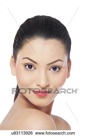 Stock Photograph - Portrait of a smiling young woman over white background . Fotosearch