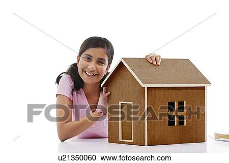 Portrait of a teenage girl with a wooden house View Large Photo Image Stock Image - Portrait of a teenage girl with a wooden house . Fotosearch