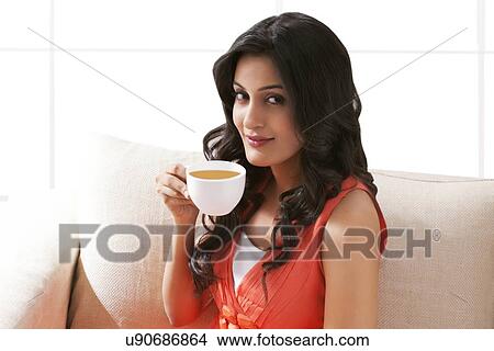 Portrait of a woman drinking a cup of coffee View Large Photo Image Picture - Portrait of a woman drinking a cup of coffee. Fotosearch
