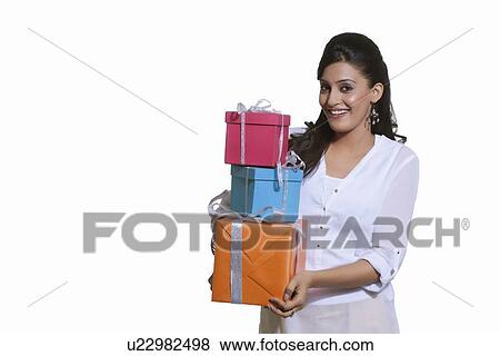 Portrait of a woman holding gift boxes View Large Photo Image Stock Photo - Portrait of a woman holding gift boxes. Fotosearch