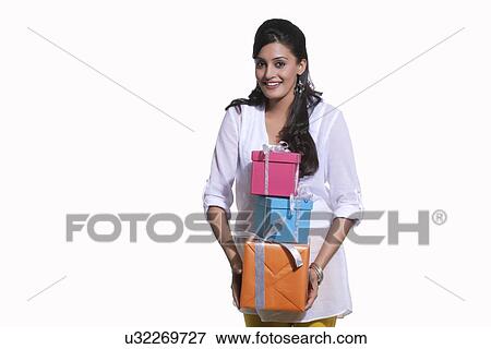 Portrait of a woman holding gift boxes View Large Photo Image Stock Photo - Portrait of a woman holding gift boxes. Fotosearch