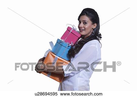 Portrait of a woman holding gift boxes View Large Photo Image Stock Photography - Portrait of a woman holding gift boxes. Fotosearch