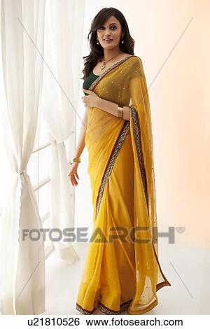 Portrait of a woman in a saree View Large Photo Image Stock Photograph - Portrait of a woman in a saree. Fotosearch