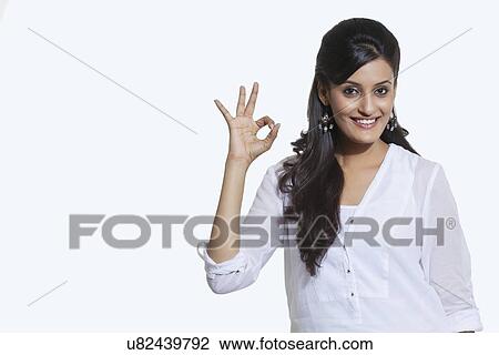 Portrait of a woman making ok sign View Large Photo Image Stock Image - Portrait of a woman making ok sign. Fotosearch