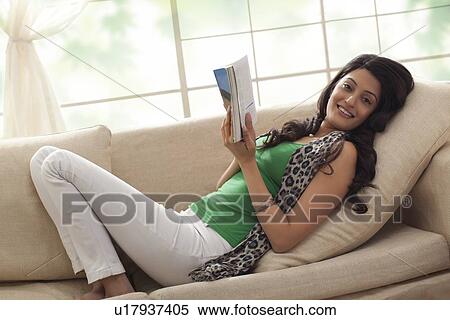 Stock Photography - Portrait of a woman reading a book. Fotosearch
