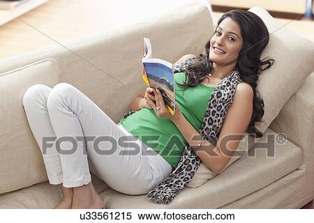 Stock Photography - Portrait of a woman reading a book. Fotosearch