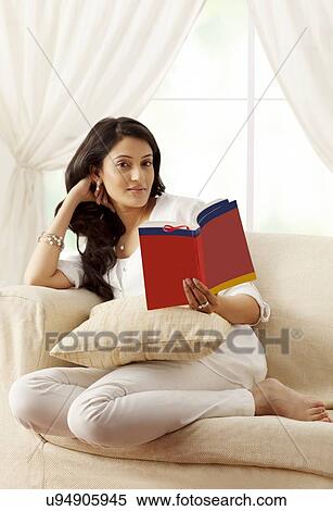 Stock Photography - Portrait of a woman reading a book. Fotosearch