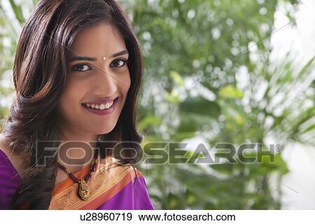 Stock Photo - Portrait of a woman smiling . Fotosearch