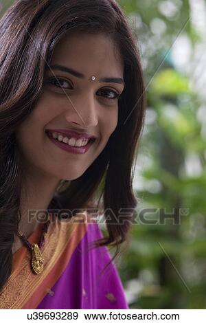 Stock Photo - Portrait of a woman smiling . Fotosearch