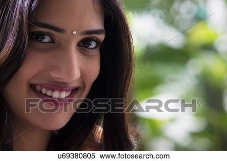 Stock Photography - Portrait of a woman smiling . Fotosearch