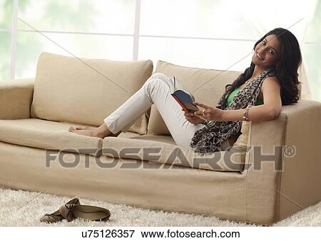 Stock Photo - Portrait of a woman with a book. Fotosearch