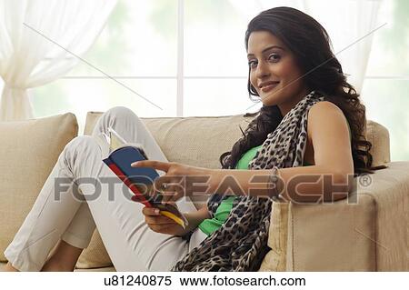 Stock Photography - Portrait of a woman with a book. Fotosearch