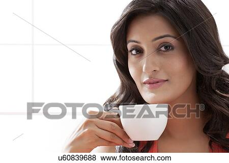 Portrait of a woman with a cup of coffee View Large Photo Image Stock Photo - Portrait of a woman with a cup of coffee. Fotosearch