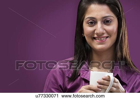 Portrait of a woman with a cup of coffee View Large Photo Image Stock Image - Portrait of a woman with a cup of coffee . Fotosearch