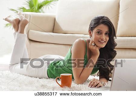 Stock Photo - Portrait of a woman with a laptop. Fotosearch