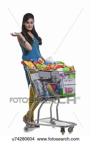 Portrait of a woman with a shopping cart View Large Photo Image Picture - Portrait of a woman with a shopping cart. Fotosearch