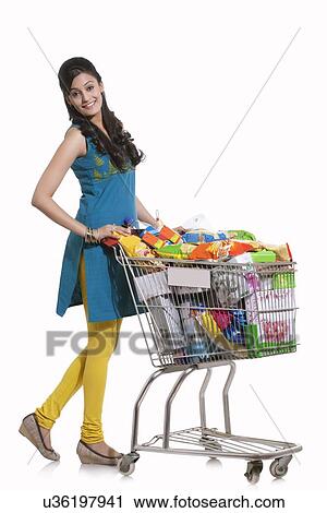 Portrait of a woman with a shopping cart View Large Photo Image Stock Image - Portrait of a woman with a shopping cart. Fotosearch
