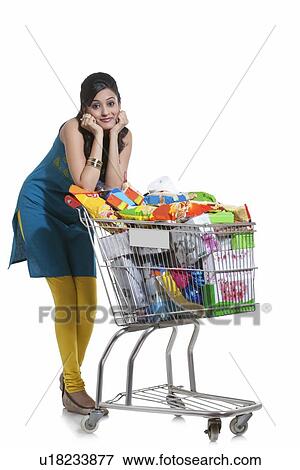 Portrait of a woman with a shopping cart View Large Photo Image Stock Photo - Portrait of a woman with a shopping cart. Fotosearch