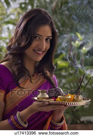Portrait of a woman with a tray View Large Photo Image Stock Photograph - Portrait of a woman with a tray . Fotosearch