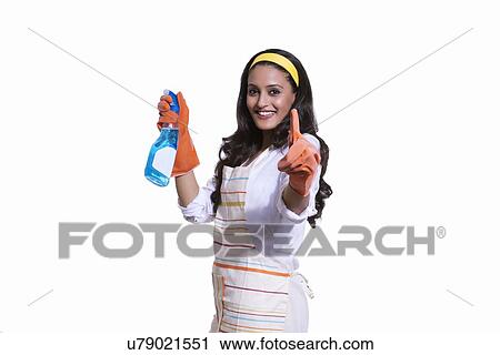 Portrait of a woman with cleaning liquid View Large Photo Image Stock Image - Portrait of a woman with cleaning liquid. Fotosearch