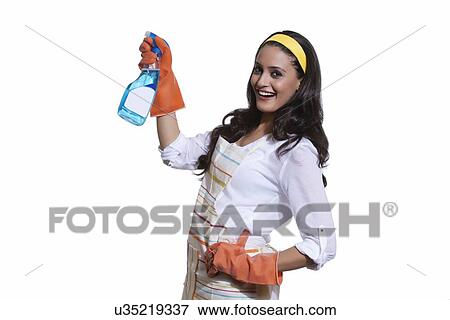 Portrait of a woman with cleaning liquid View Large Photo Image Stock Photo - Portrait of a woman with cleaning liquid. Fotosearch
