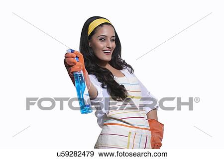 Portrait of a woman with cleaning liquid View Large Photo Image Stock Photo - Portrait of a woman with cleaning liquid. Fotosearch