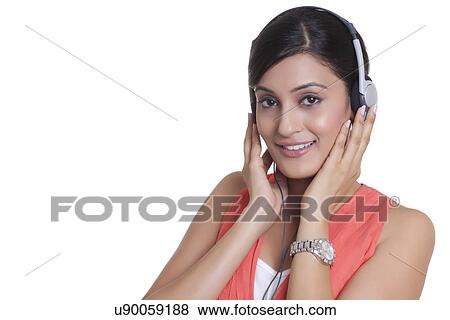 Portrait of a woman with headphones listening to music View Large Photo Image Stock Photo - Portrait of a woman with headphones listening to music. Fotosearch