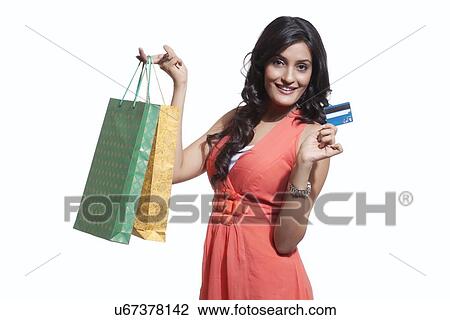 Portrait of a woman with shopping bags and credit card View Large Photo Image Stock Image - Portrait of a woman with shopping bags and credit card. Fotosearch