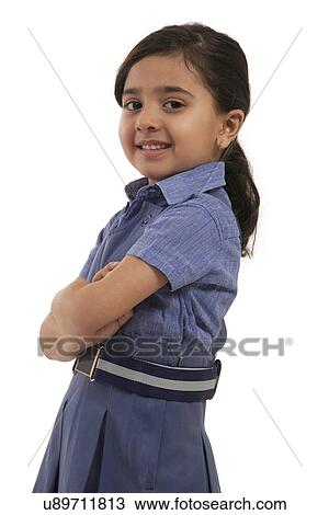 Stock Image - Portrait of a young school girl smiling . Fotosearch